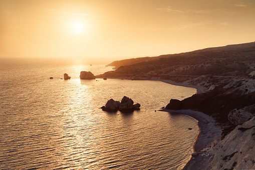 Panoramic sunset landscape of Petra tou Romiou (The rock of the Greek), Aphrodite's legendary birthplace in Paphos, Cyprus island, Mediterranean Sea.