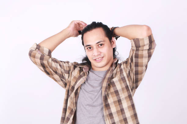 istock Male Asian Model Tying His Long Hair 682680672
