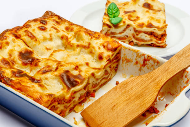 istock Portion of tasty lasagna isolated on white 682692780