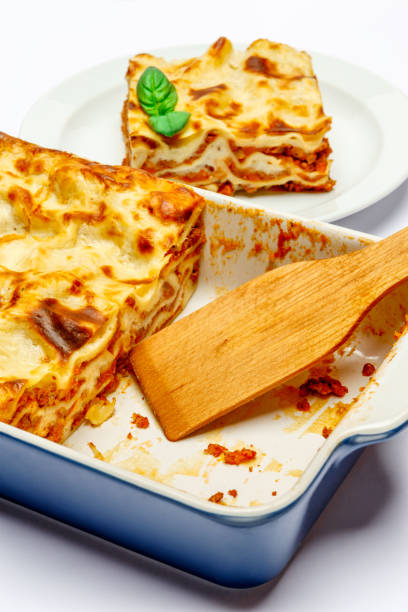 istock Portion of tasty lasagna isolated on white 682693032