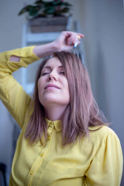 istock pretty girl sitting at desk in bright office, 682696472