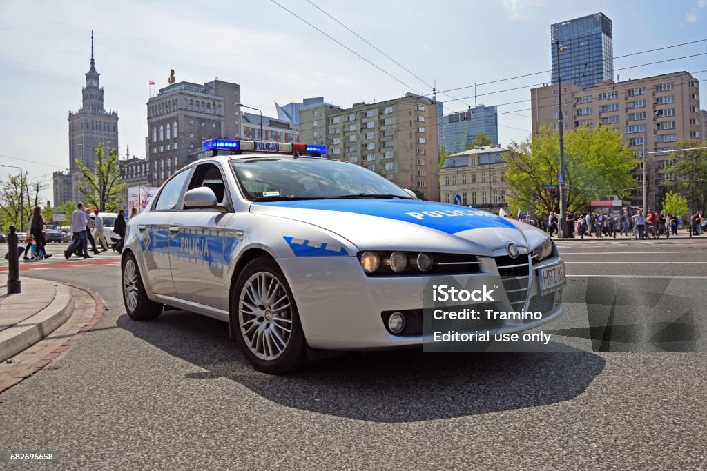 Alfa Romeo 159 police car on the street Warsaw, Poland - 6th May, 2017: Alfa Romeo 159 police car stopped on the street. This vehicle is used to patrols on the streets. Alfa Romeo Stock Photo