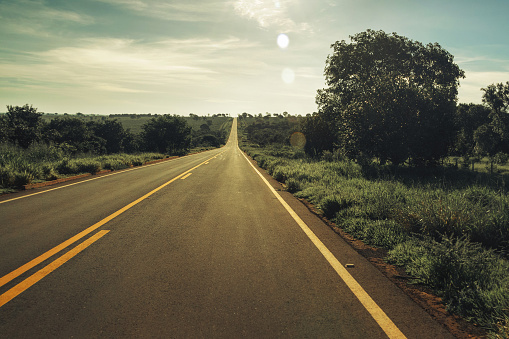 Vintage toned Highway with fields around and no car on the road, Mato Grosso do Sul - Brazil.