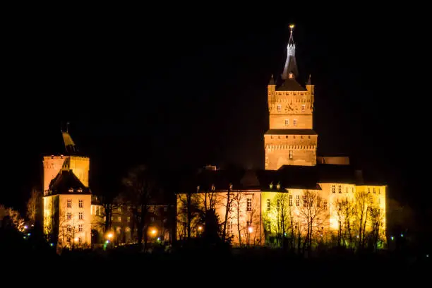 Photo of Old german castle tower clock palace at night