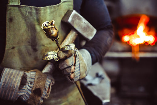 Blacksmith holding forged rose