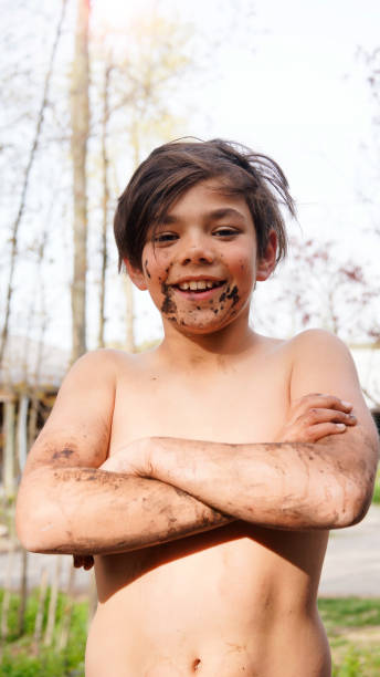 istock A happy eleven year-old boy dirty with mud after playing outside 682707130