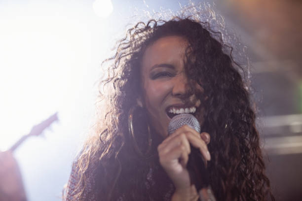 istock Young female singer performing in nightclub 682714146