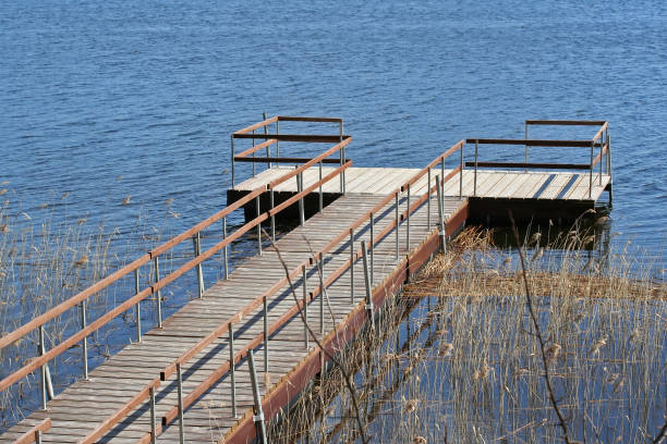 istock a dock with pontoon boat on Lake 682717934