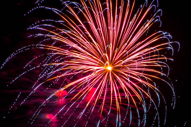 Firework fireworks celebration blue spikes red purple yellow Firework fireworks celebration blue spikes red purple yellow hogmanay photos stock pictures, royalty-free photos & images