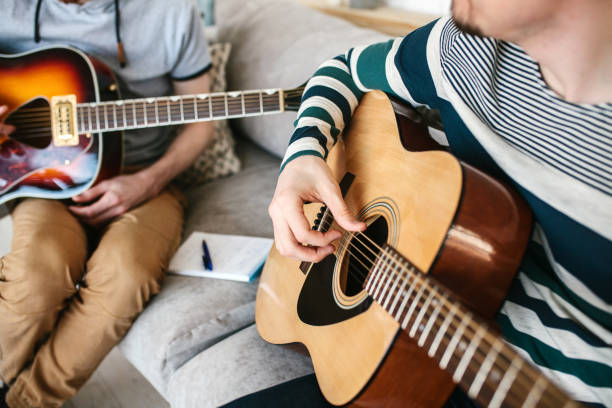 istock Learning to play the guitar. Music education. 682731230