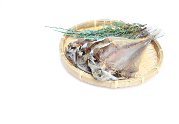 Pictured dried Horse mackerel on a bamboo colander.