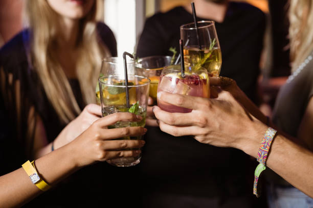 istock Close up of friends toasting drinks 682739774
