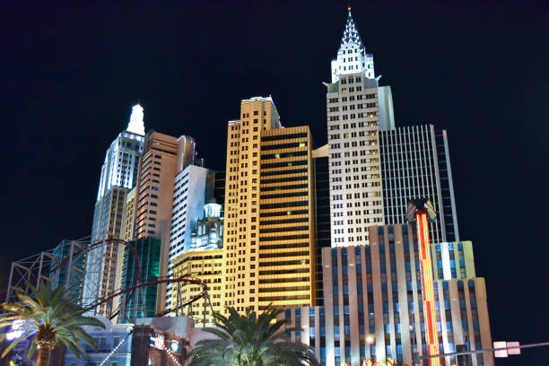 Surveillance camera and modern city buildings with blue sky background