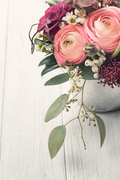 istock Bouquet of flowers in tin mug on light background 682759942