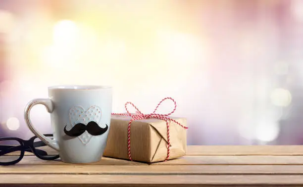Gift With Glasses And Coffeecup On Table