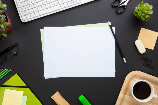 istock Blank Paper Surrounded By Office Equipment On Gray Desk 682763514