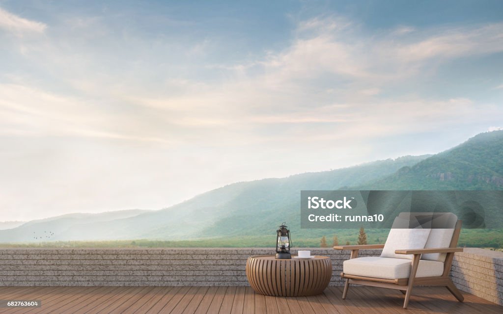 Outdoor living with mountain view 3d rendering image Outdoor living with mountain view 3d rendering image.Decorate with wood furniture There are wooden floor,stone wall and surrounding with nature and mountains Armchair Stock Photo