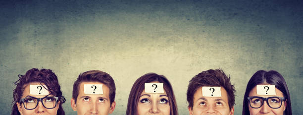 istock Group of thinking people with question mark looking up 682764116