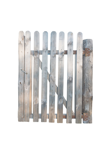 Wooden planks door in garden fence isolated on white