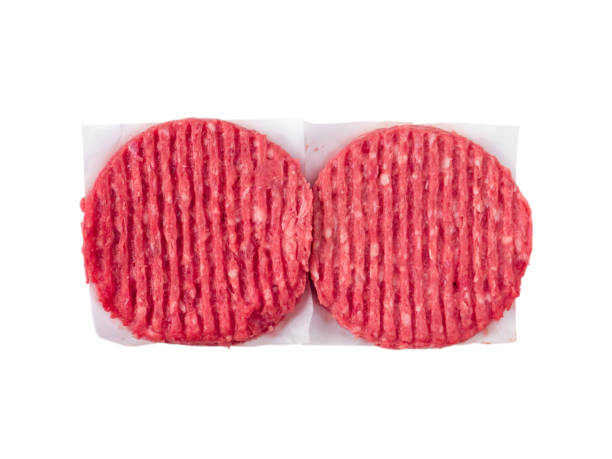 istock Two mixed pork and beef burgers on the paper sheets isolated on white 682772994