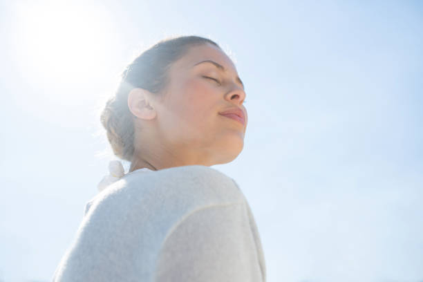 istock Low angle view of woman with eyes closed 682773034