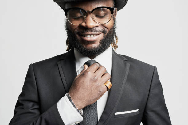 African Man with Dreadlocks African man with dreadlocks. man adjusting tie stock pictures, royalty-free photos & images