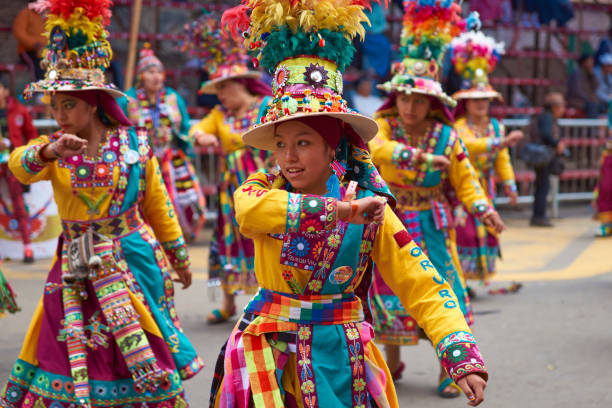 Tinkus Dance Group at the Oruro Carnival Oruro, Bolivia - February 26, 2017: Tinkus dancers from the group Los Tolkas, performing in Av 6 de Agosto, at the annual Oruro Carnival in Bolivia. The event has been classified by UNESCO as being of Intangible Cultural Heritage of Humanity and attracts around 30,000 dancers and musicians. bolivia photos stock pictures, royalty-free photos & images
