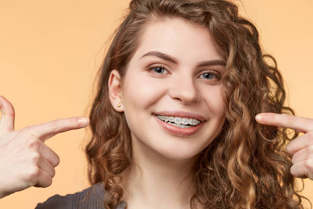 istock curly hair woman with brackets 682789610