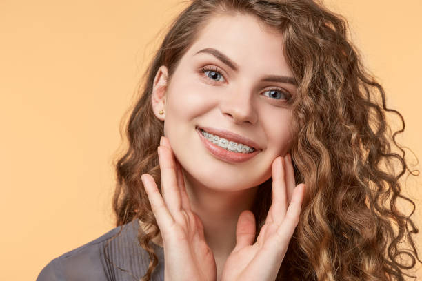 istock curly hair woman with brackets 682789656
