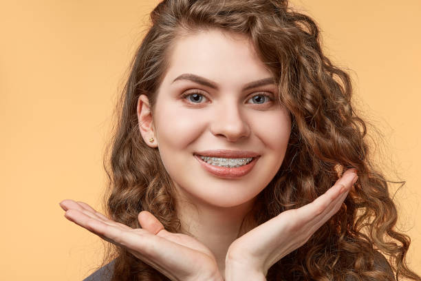 istock curly hair woman with brackets 682789710