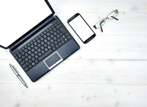 istock Topview desktop laptop smartphone glasses pen 682795412