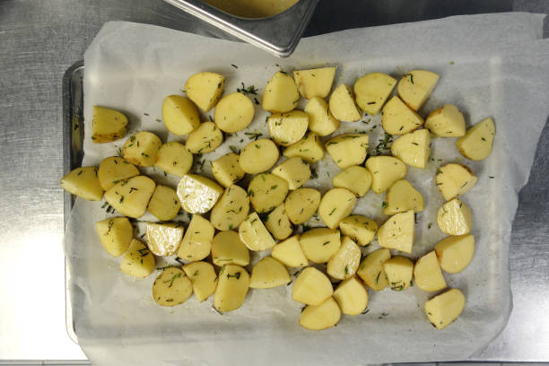 istock preparing potato in commercial kitchen 682795444
