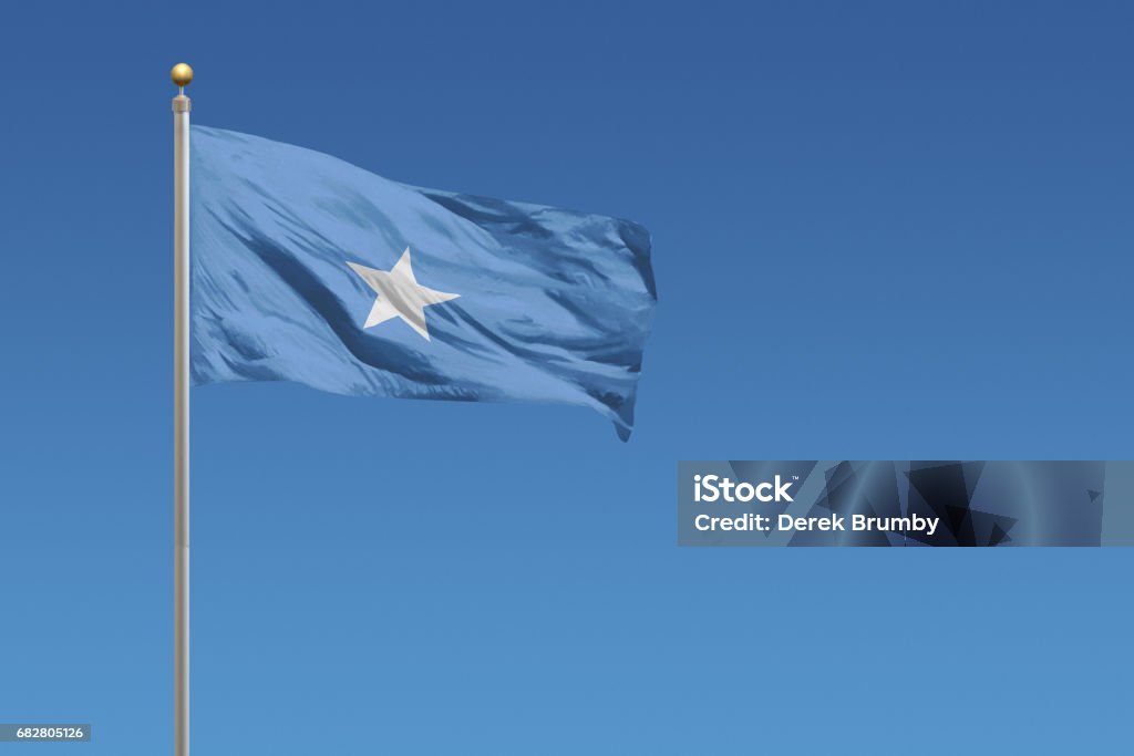 Flag of Somalia Flag of Somalia in front of a clear blue sky Somalia Stock Photo