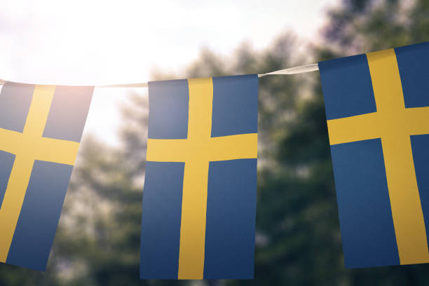 Flag of Sweden Flag of Sweden hanging pennants sweden flag stock pictures, royalty-free photos & images