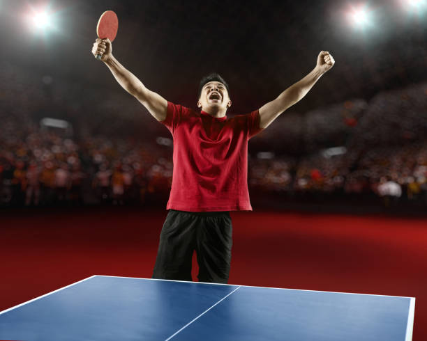 Table tennis - racket, ball, table. Tabletennis or ping pong rackets and yellow balls on blue table. Sport concept. Table tennis