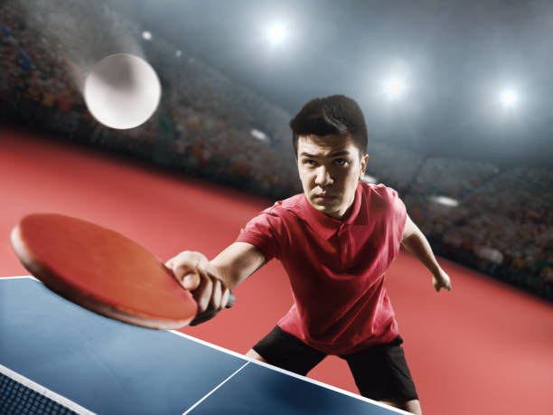 istock Young asian ping pong player playing table tennis game 682820210