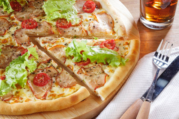 istock Delicious pizza with salad leaves and bacon. Stock Image 682821920
