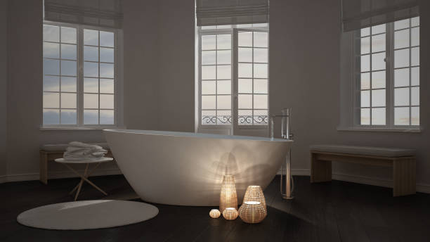 istock Illuminated candles inside a minimalist bathroom, spa zen interior design 682824996