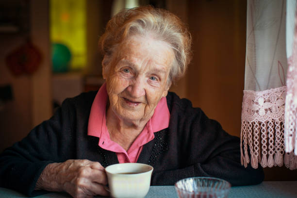 istock Elderly retired woman drinking tea in his house. 682829070