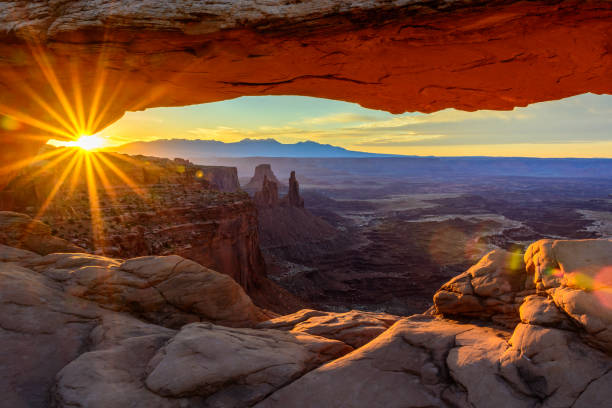 Sunrise at Mesa Arch Sunrise at Mesa Arch, Canyonlands National Park, Moab, UT. canyonlands national park stock pictures, royalty-free photos & images