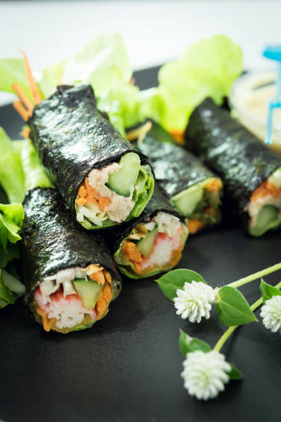 istock closeup Salad roll in black dish 682838544
