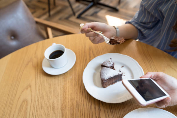 istock Women use smartphones at cafes. 682880056
