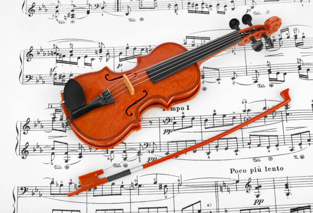 istock Toy violin and music sheet 682904182