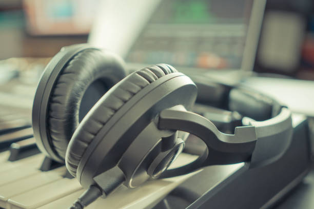 istock Studio Music headphone on music keyboard in a Home music studio DAW desktop 682909632