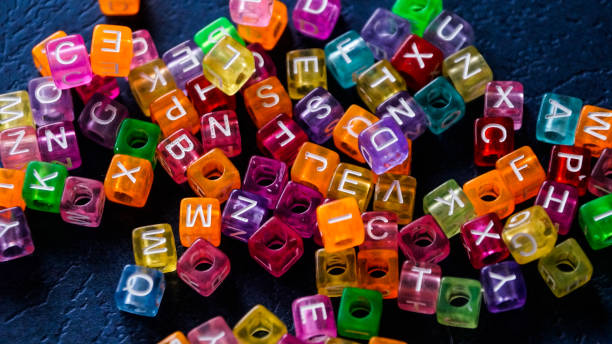 Many colorful decorative cubes with letter Many colorful decorative cubes with letter. Photo. seria stock pictures, royalty-free photos & images