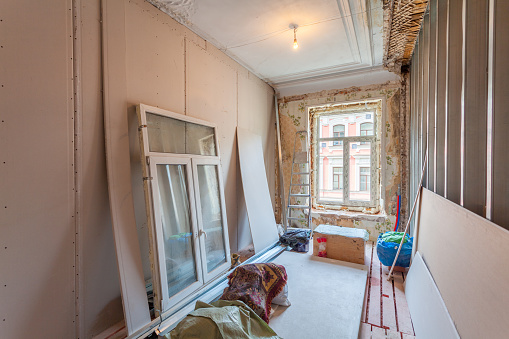 Interior of apartment with materials during on the renovation and construction ( the installation of window)