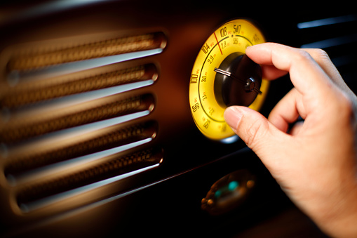 Man's Hand tuning fm Retro radio knob Close-up