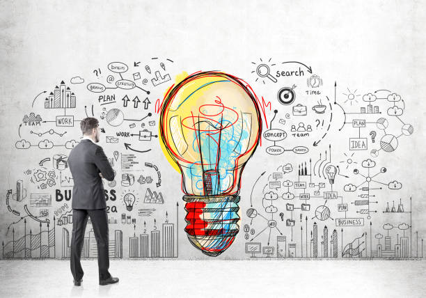 istock Rear view of man looking at colorful bulb 682936070