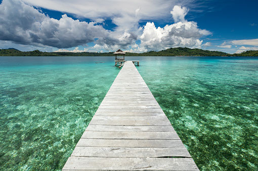 In the Togean islands of Central Sulawesi, the local Bajau people have built their villages on stilt and wooden jetty to be able to access the mainland. This jetty enables local boats to access the tourism cottage of Boli Langa.