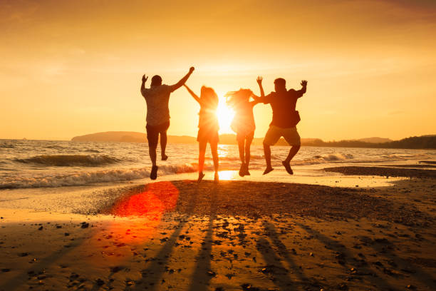 istock Asian family running on beach 682936902